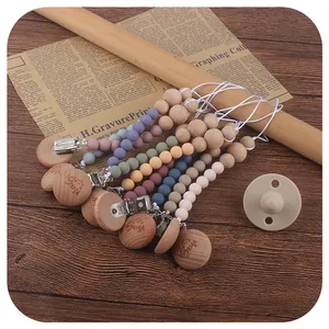 Beech wood pacifier clip with baby smile face design and Morandi color silicone beads