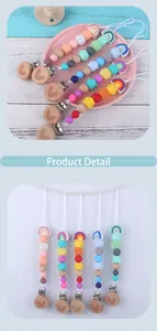 Detail of baby pacifier clips with silicone beads, beech wood clip, and rainbow pendant