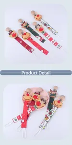 Detail of Christmas reindeer pacifier clips with festive ribbon patterns and wooden grips
