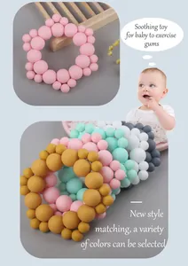 Macro detail of multi-colored silicone teething rings with soft macaron bead textures
