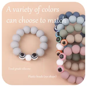 Silicone beaded baby teether bracelet with acrylic eye design in Morandi colors