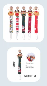 Close-up of 29cm Christmas reindeer pacifier clips with festive ribbons and wood buckle