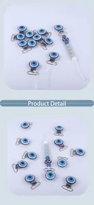 Detailed view of silver metal pacifier clip with blue Evil Eye and gradient beaded chain