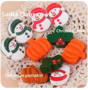 Close-up of DIY Christmas silicone beads featuring snowman, pumpkin, and holly leaf shapes