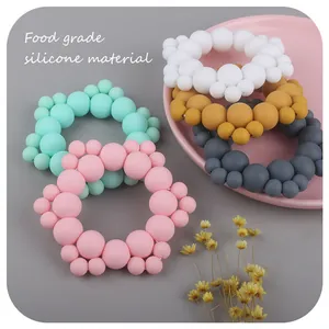 Food grade silicone baby teething ring with colorful matte beads in pastel tones