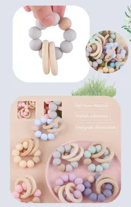 Detail of colorful food-grade silicone beads and natural beech wood rings for baby teething