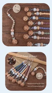 Detail view of beechwood pacifier clips and silicone beads in Morandi color tones