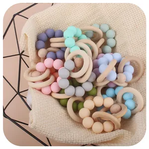 Beech wood and silicone baby teething bracelet set in macaron colors and metal basket