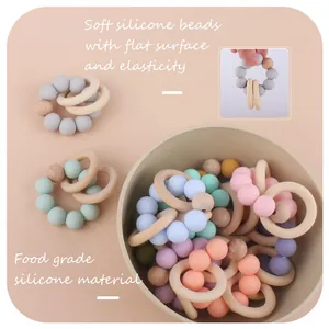 Baby teething ring toy made of food grade silicone beads and natural beech wood rings