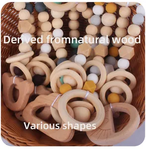 Detail of baby teething toy set with beech wood rings and colorful silicone beads