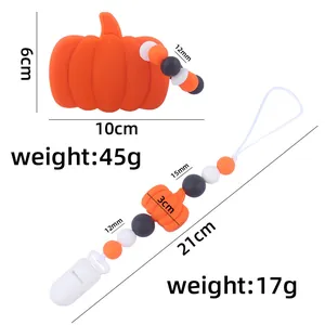 Massaggiagengive zucca in silicone e catenella portaciuccio Halloween per neonati
