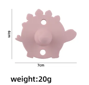 Rosa Silikon-Beißring Dinosaurier mit Maßen von 7x6 cm und einem Gewicht von nur 20 g