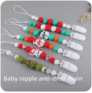 Detail of Christmas silicone pacifier clips with snowman and tree beads for baby safety