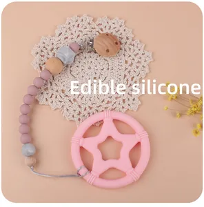 Baby Stern-Beißring mit Silikon- und Holzperlen-Schnullerkette auf ästhetischem Hintergrund