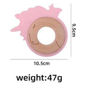 Pink silicone unicorn teether with beech wood ring showing 10.5cm width dimensions