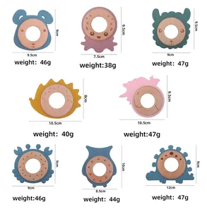 Various cartoon animal beech wood and silicone baby teethers with dimensions and weights