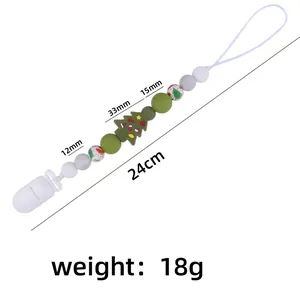 Detailed view of Christmas pacifier clip with 24cm silicone beads and green tree
