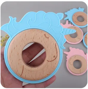 Macro detail of unicorn teether with natural beech wood ring and food-grade soft silicone