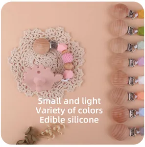 Attache-tétine en hêtre et perles silicone avec pendentif dinosaure rose et divers coloris