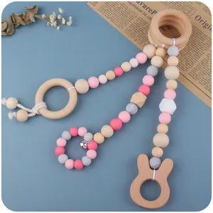 Set de mordedores para bebé con anillos de madera de haya, silicona y un cascabel