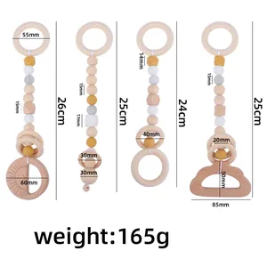 Set of 4 beech wood and silicone baby gym hanging toys with dimensions and weights
