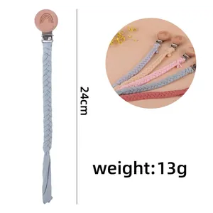 Handmade rainbow beech wood pacifier clip with woven cotton strap for infants