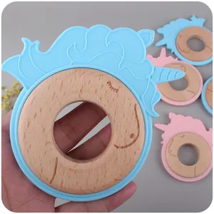 Cartoon unicorn baby teether with natural beech wood ring and soft food grade silicone