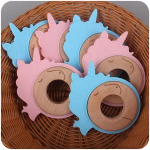 Baby unicorn teething rings made of natural beech wood and soft colorful silicone