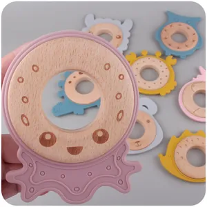 Baby wooden teether with food-grade silicone animal shapes and engraved cartoon smiley face