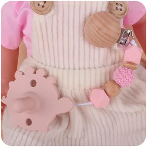 Sucette en silicone avec clip en hêtre et chaîne à perles roses sur vêtements