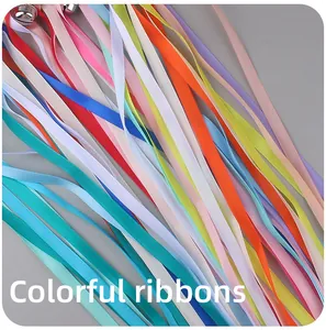 Detail of colorful satin ribbons with small metal bells for baby sensory teething toys