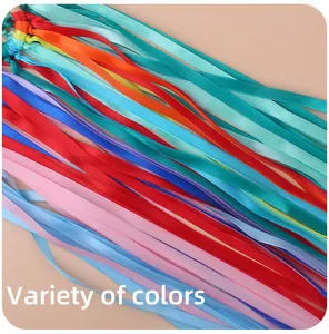 Close-up of vibrant colorful satin ribbons attached to a natural beech wood sensory ring