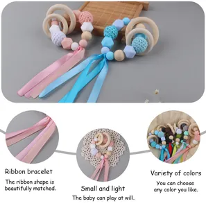 Detail of baby teething ring with crochet beads, silicone beads and long colorful ribbons