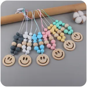 Smiley silicone and wood teething necklace set in macaron colors for infant soothing