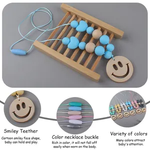 Baby silicone teether necklace with wooden smiley face pendant and colorful safety beads