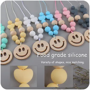 Smiley face baby teether necklace with colorful food grade silicone beads and wooden pendant
