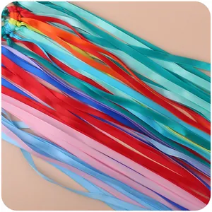 Colorful ribbon sensory toy with beech wood ring for babies for motor skill development