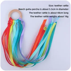 Rainbow ribbon baby teether with beech wood ring for sensory play and motor skills