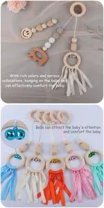 Detail of wooden baby gym toys with beechwood rings, tassels, and colorful jingling bells