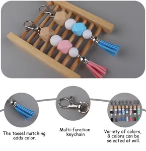 Detail of colorful silicone bead keychain with faux suede tassel and wood bead accent