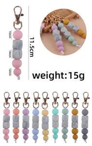 Detail view of colorful silicone bead keychain showing 11.5cm length and varied bead sizes