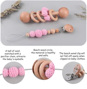Detail view of beechwood baby rattle and pink crochet bead pacifier clip set