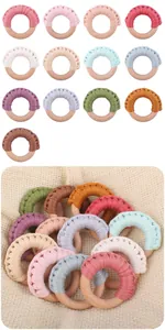 Macro detail of handmade cotton weave baby teether rings in thirteen assorted colors