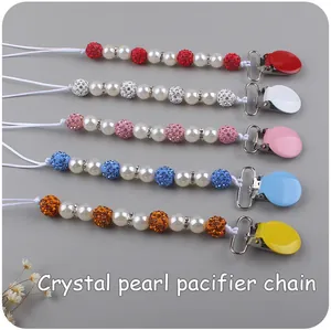 Detail of five crystal pearl pacifier clips with rhinestone beads and metal clips