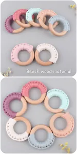 Detail of beech wood baby teething ring with colorful handmade cotton woven textures