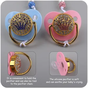 Macro detail of jeweled crown pacifier showing food-grade silicone teat and gold handle
