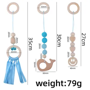 Three-piece baby wooden gym hanging toys with crochet beads, bells, and whale teether