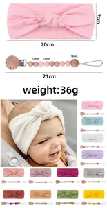 Pink infant headband and silicone beaded pacifier clip set with specific dimension details