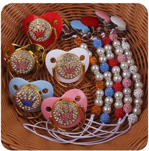 Detailed set of luxury crown baby pacifiers and matching pearl clips in five colors