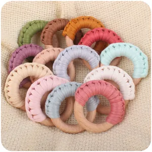 Handmade cotton woven beech wood teething rings for infants in pastel macaron colors